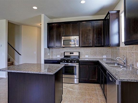 Granite countertops, stainless steel appliances, including gas range!