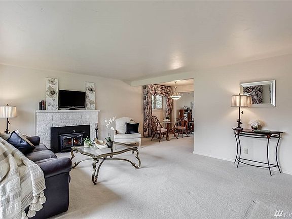 Enter to a spacious living room that opens to the eat-in kitchen.