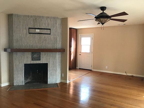 Living room/Fireplace with TV mount/Side door out to grill