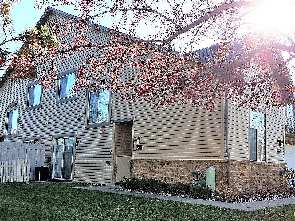 View from yard to front entrance and patio door