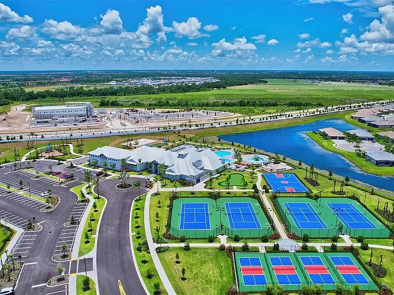 Amenity Center: basketball, bocce, tennis, volleyball, pickleball, gym and yoga room, game room, multiple pools, onsite restaurant and more!
