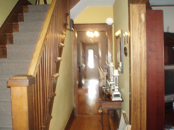 hallway with original moldings throughout