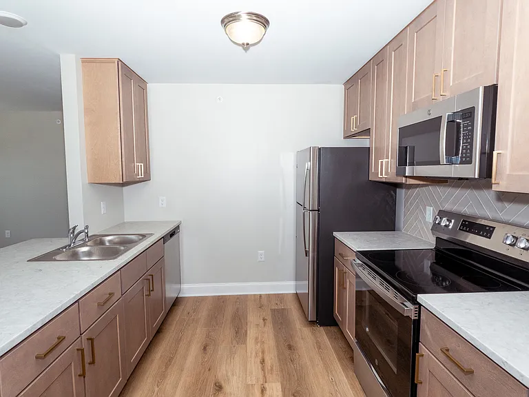 Closer view of kitchen from entrance door.