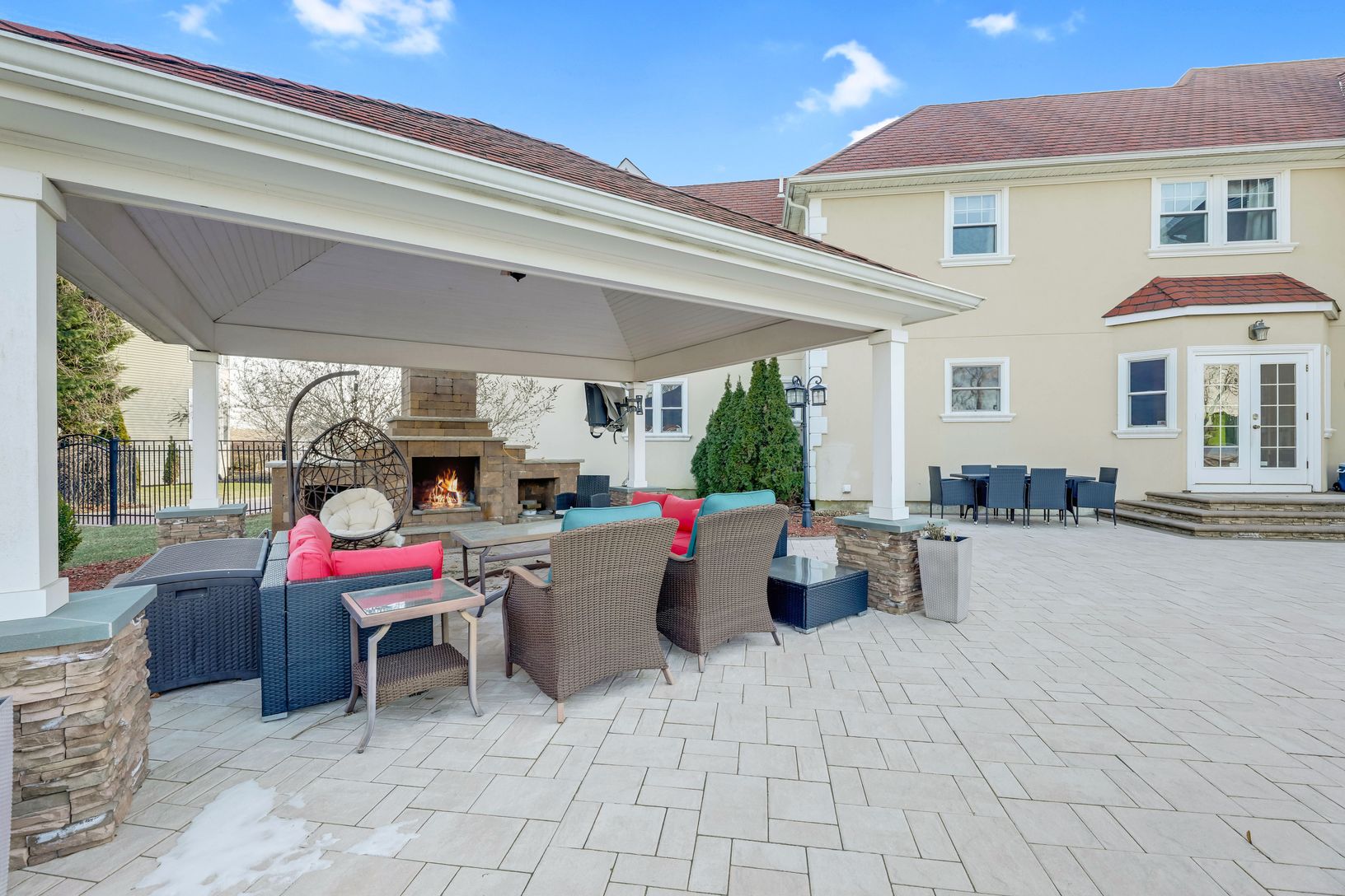  Covered Pavilion with a Mounted TV, Ceiling Fan, and a Custom Built-in Gas Grill