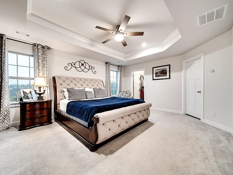 Master bedroom with tray ceiling.