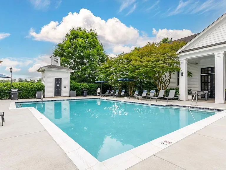 Swimming pool and sundeck with lounge seating
