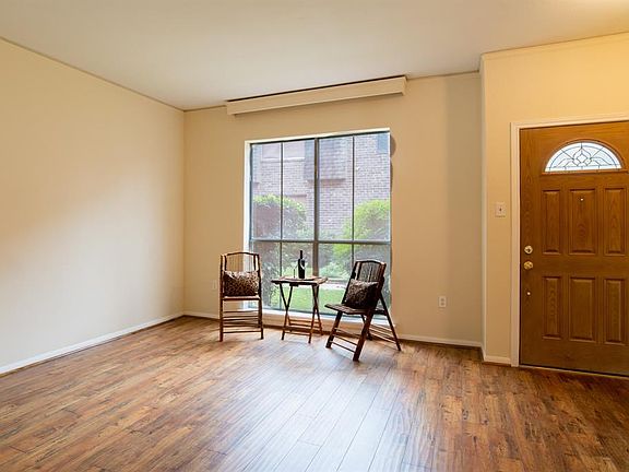 Step into the living area with nice rich looking wood-like flooring.