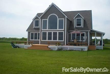 The Lake Side of the House
						:
						East facing, virtual wall of windows offers a panoramic view of Lake Champlain