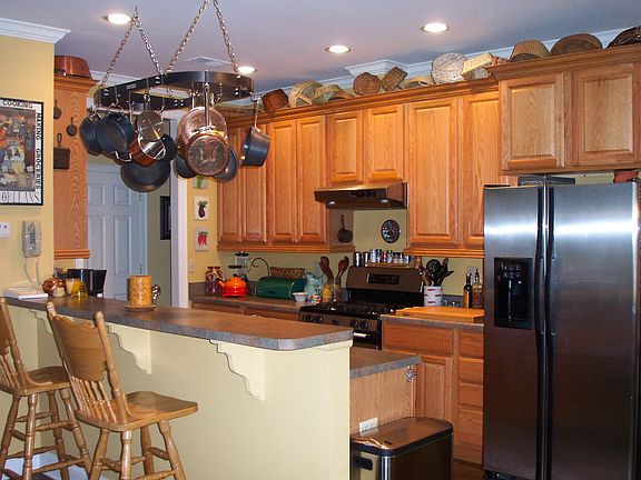 Open to the great room, here is the kitchen w/breakfast bar.