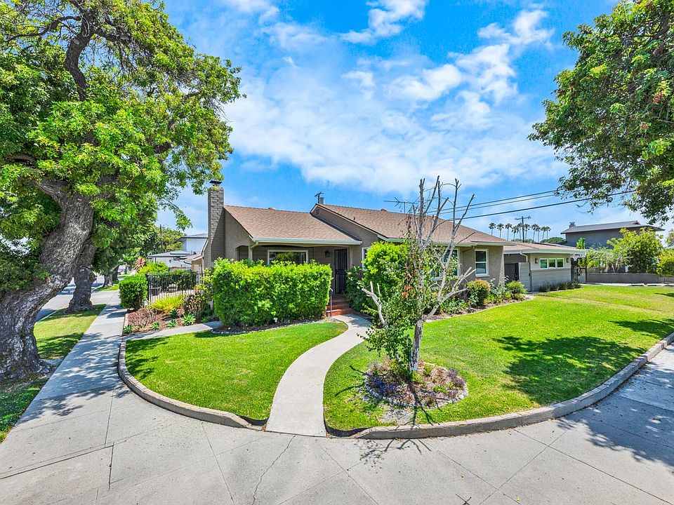 Beautiful corner-lot home in Long Beach's sought-after Plaza neighborhood, just one block from award-winning Cubberley K-8 School.