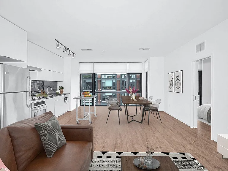 Open concept layout (kitchen, living room, & dining room-staged)