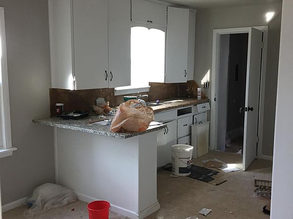 New granite countertops, installing tile backsplash this wee