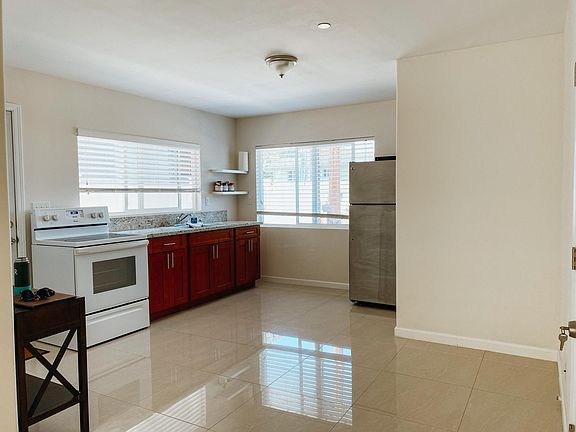 Open floor plan connecting kitchen, dinning, and living room