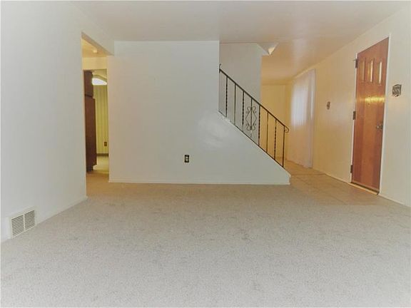 Another view from the living room of the circular flow around the center stair on the main level counter clockwise through the d