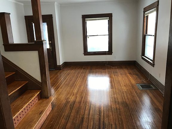 Entrance, living room and stairway to 2nd floor