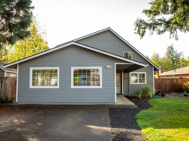 Driveway has room for 2 cars, in front of large bonus room (converted, finished garage)