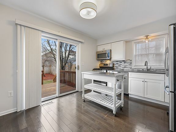 Kitchen w/Views to Sliders and Private Backyard