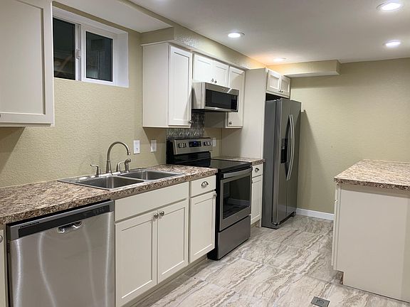 Beautiful Kitchen with stainless steel appliances.