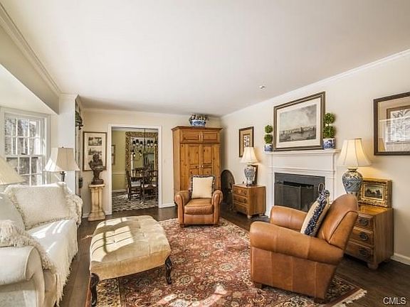 Living room with wide plank floors and fireplace