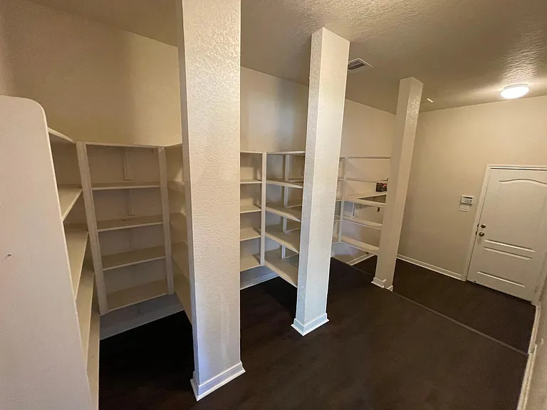 Huge Pantry eliminates constant grocery runs. Area left of door is for Washer and Dryer.