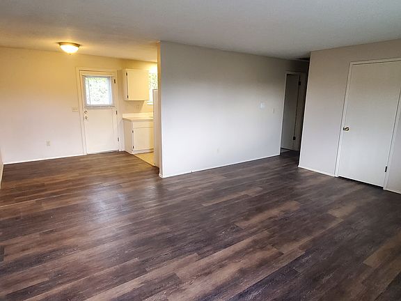 Front door entry into living, dining and hallway