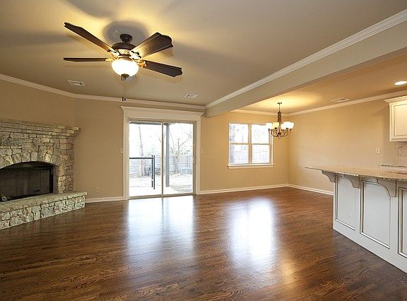 Spacious living room with stone fireplace