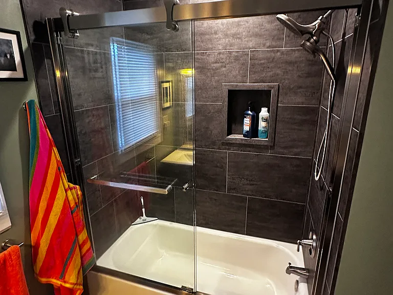 The new tub is great for both showering and soaking.