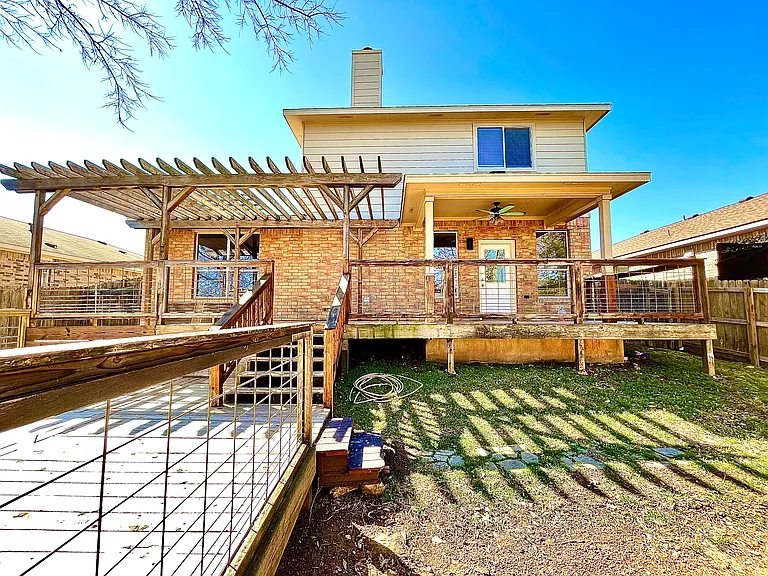 Backyard comes with two large wooden decks and a pergola patio