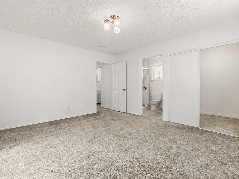 Large 2nd bedroom with new mirror closet door.