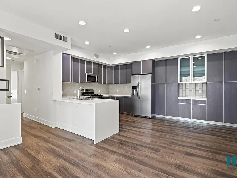 Spacious Kitchen and Dining Area with Ample Cabinet Storage