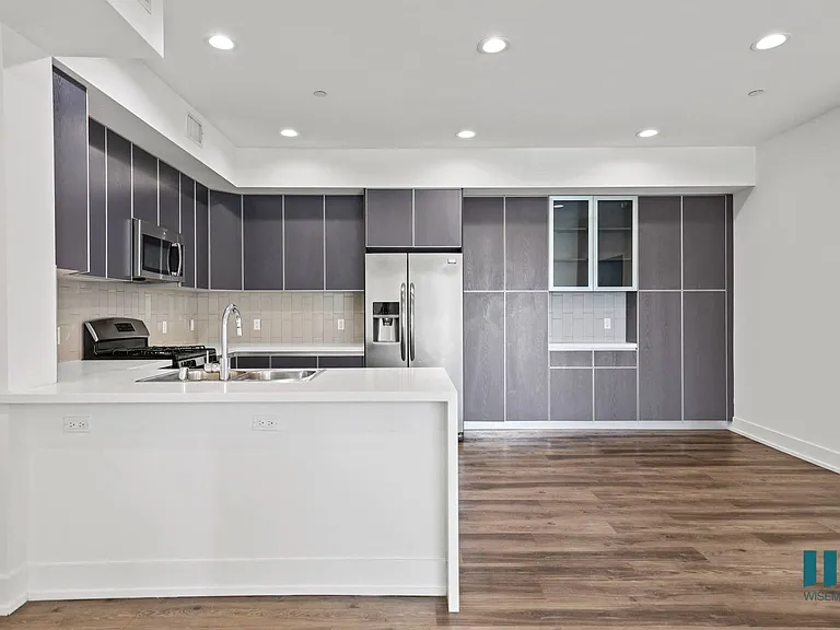 Open-Concept Kitchen and Dining Area with Cabinet Storage