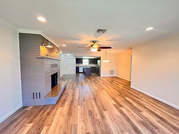 View from Lanai sliding glass doors back to living area, dining and kitchen, all the way to the front door.