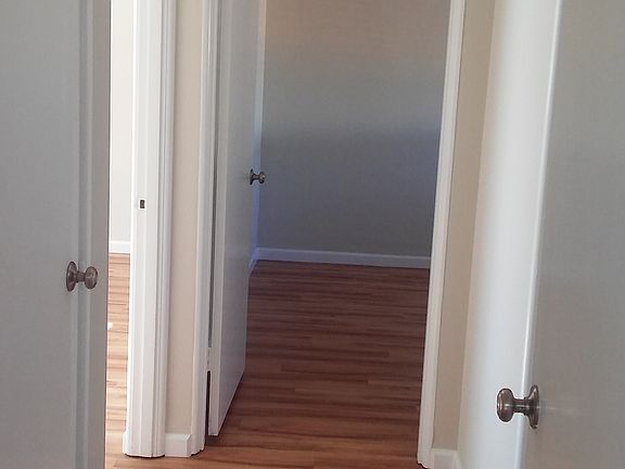 Hallway with 2 storage closets
