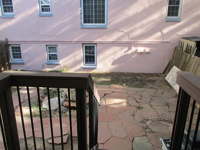 Quaint back yard, great for BBQ and raised garden.