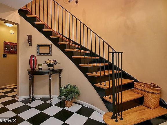 Ceramic tile floor and curved staircase)