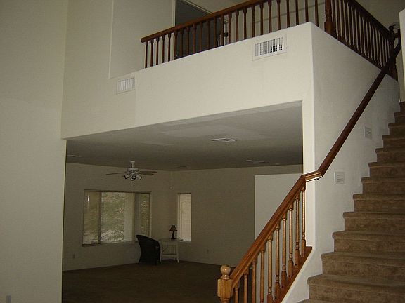Oak stair rail leads you to loft.