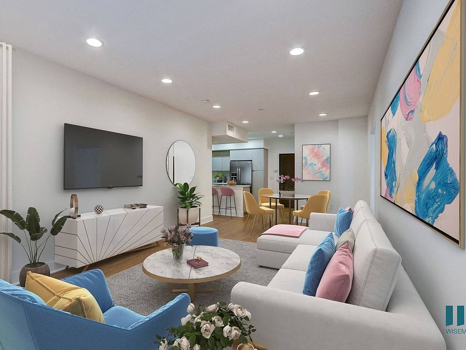 Open-Concept Kitchen, Dining, and Living Room with Vinyl Flooring and Recessed Lighting