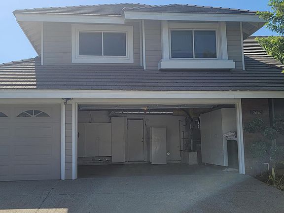 Three car garage with plenty of cabinets for storage