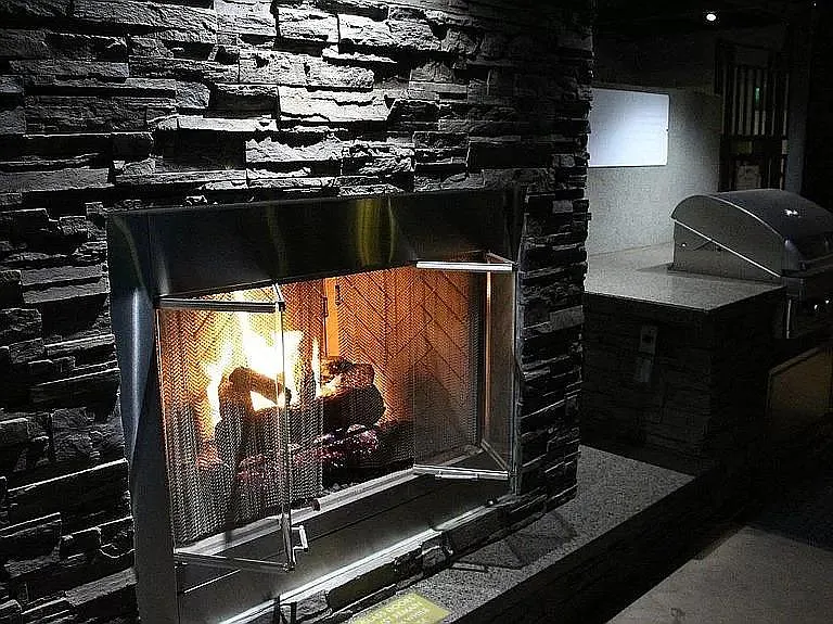 Fireplace and BBQ by pool.
