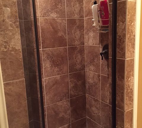 tile shower w/ glass door