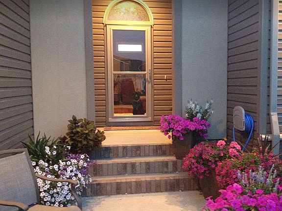 Covered front porch door.