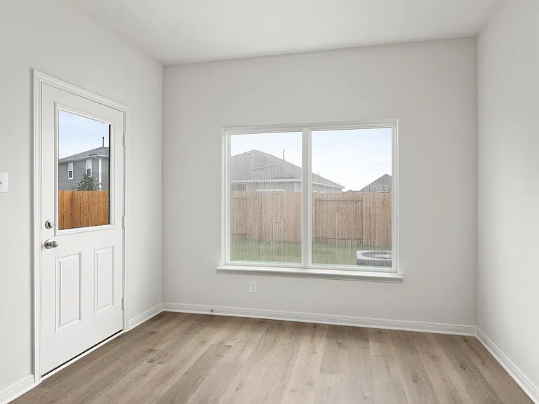 The dining room sits right off of the kitchen.