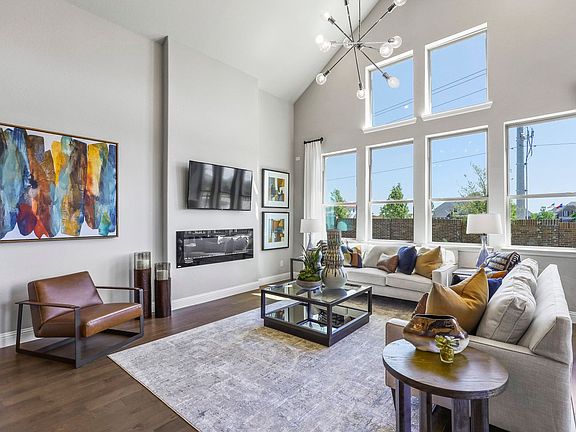 Living room in the Keats home plan by Trophy Signature Homes - REPRESENTATIVE PHOTO