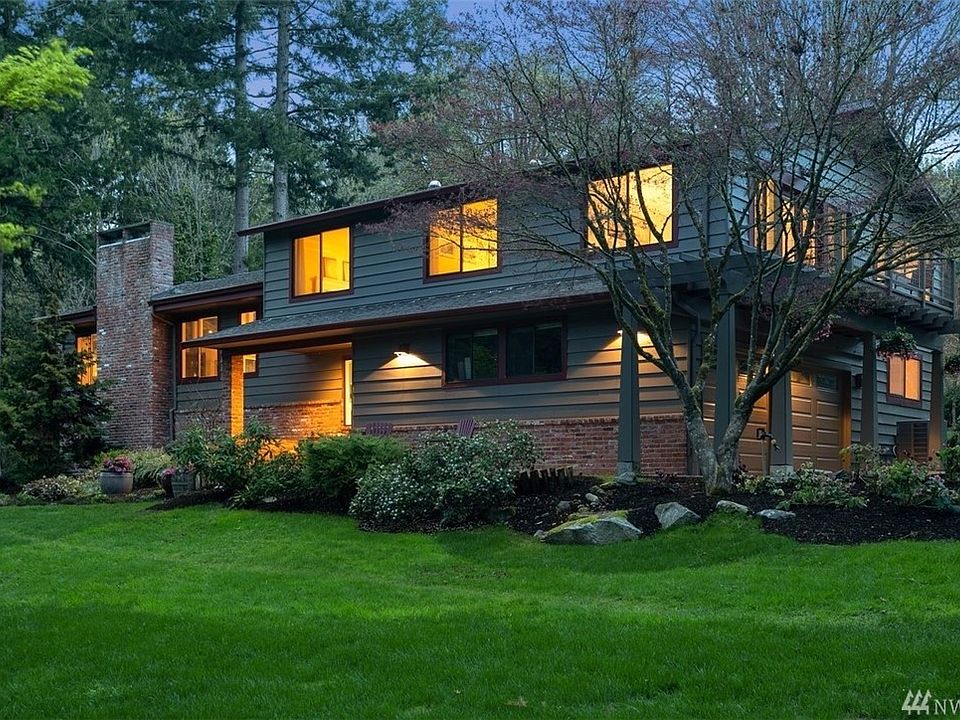 Home welcomes you as you come down drive to garage at back of house