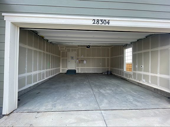 2 car garage with raised ceilin