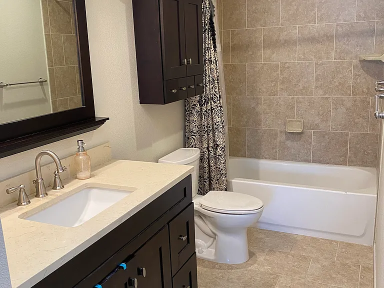 Primary bathroom attached to primary bedroom