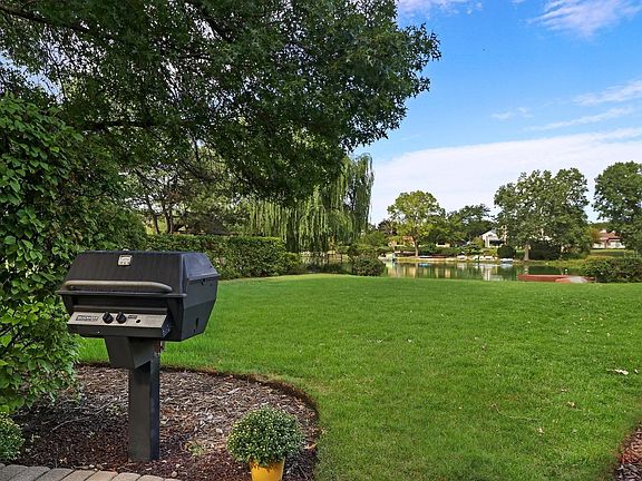 .61 acres. Beautifully Landscaped. Mature Trees and Lovely Plantings.