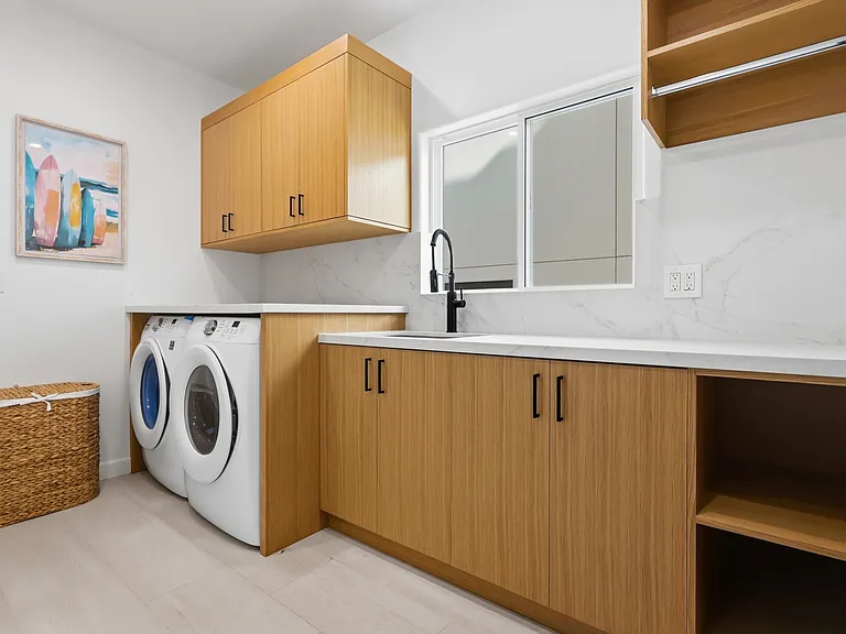 Laundry room sits on the second floor, strategically tucked in between all the bedrooms. Additional laundry hookups in garage.