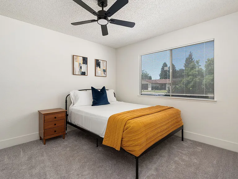 Bedroom 1. 11'x11'. Custom closet. Queen size bed.