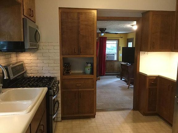 Kitchen with newer stainless steel appliances.